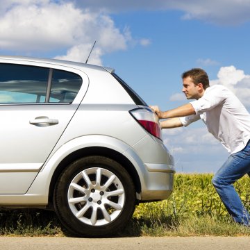 extended car warranty services protect my car car broken man pushing broken car on the side of the road